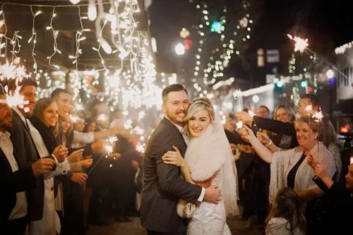 Display of wedding entertainment packages including DJ booth and lighting systems