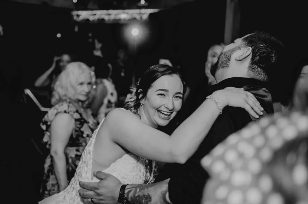 Multicultural wedding DJ engaging diverse guests with inclusive music